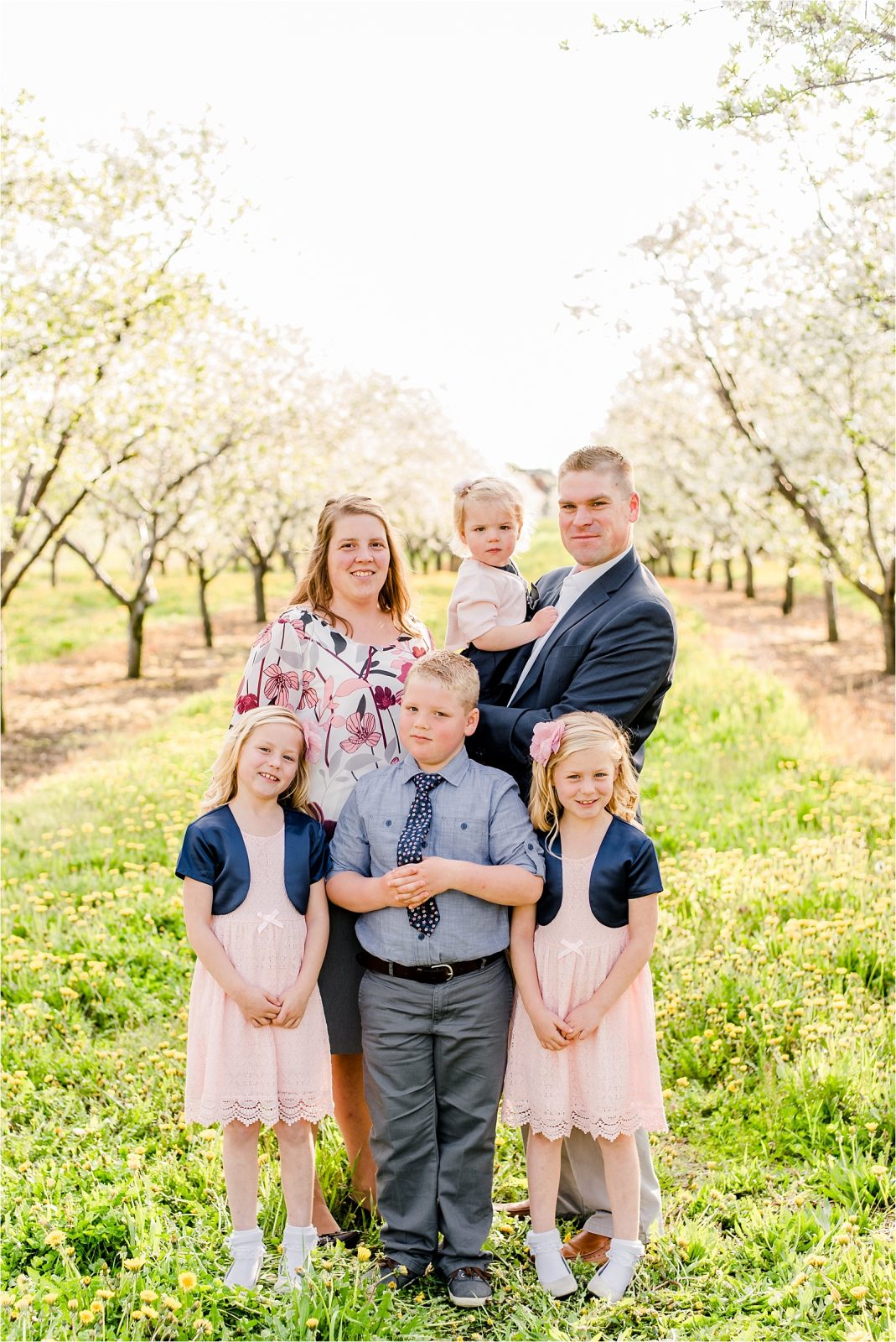 Cherry farm family hugging smiling