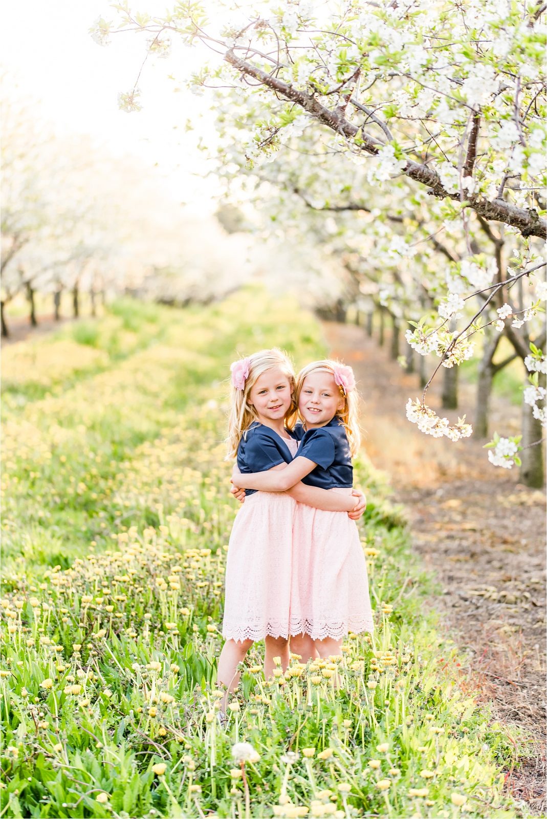 Cherry orchard twins hugging