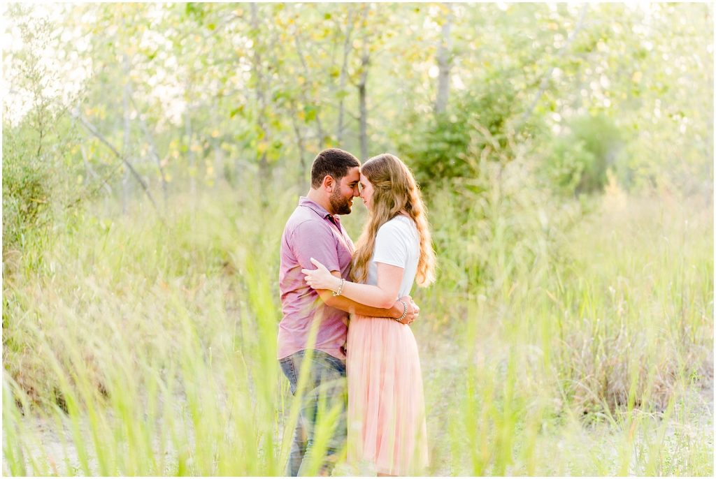 engaged couple fiancé engagement session beach port burwell ontario