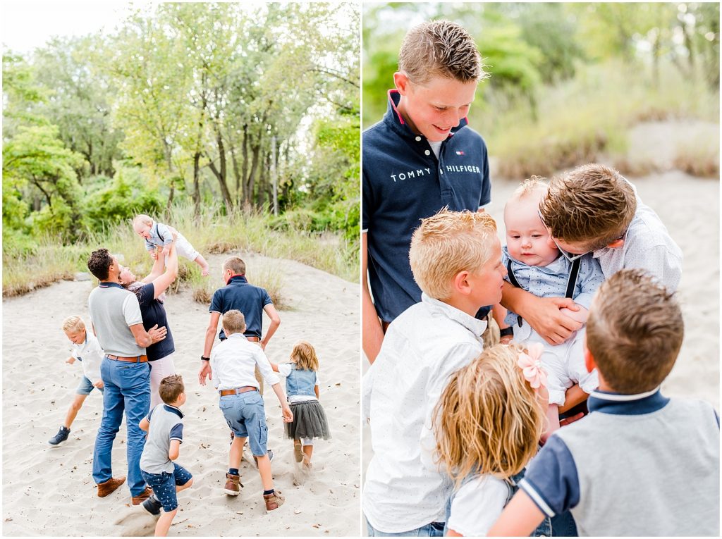 lake erie long point beach family having fun kissing baby