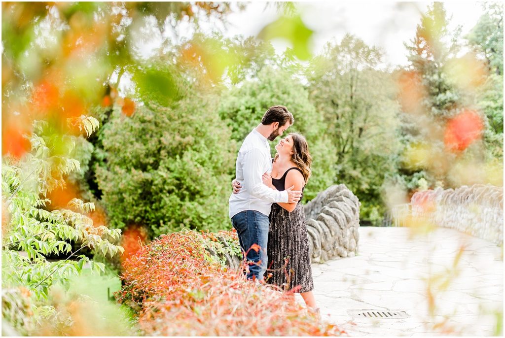 Spencer Gorge Engagement Session couple snuggling on bridge