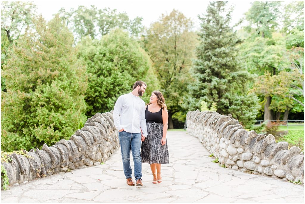 Spencer Gorge Engagement Session couple walking on bridge