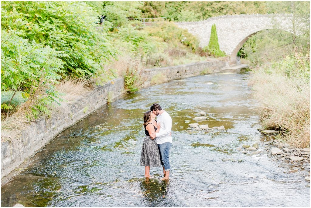 Spencer Gorge Engagement Session couple snuggling in the Grand River