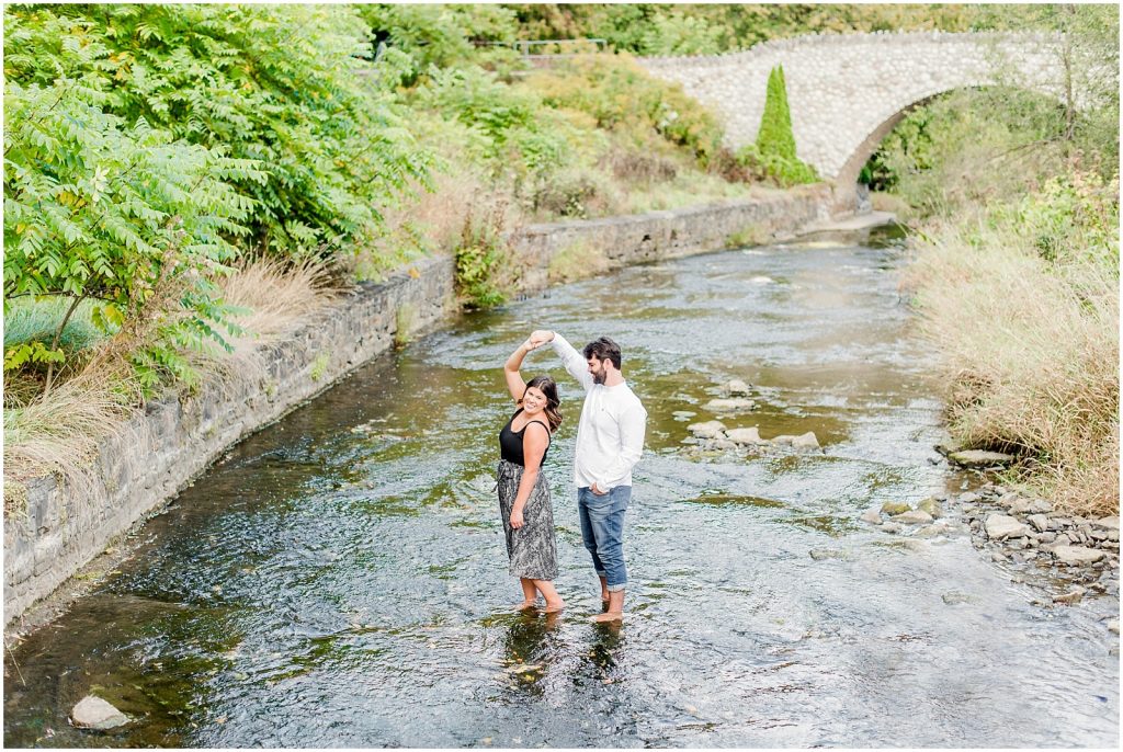 Spencer Gorge Engagement Session couple dancing in the Grand River