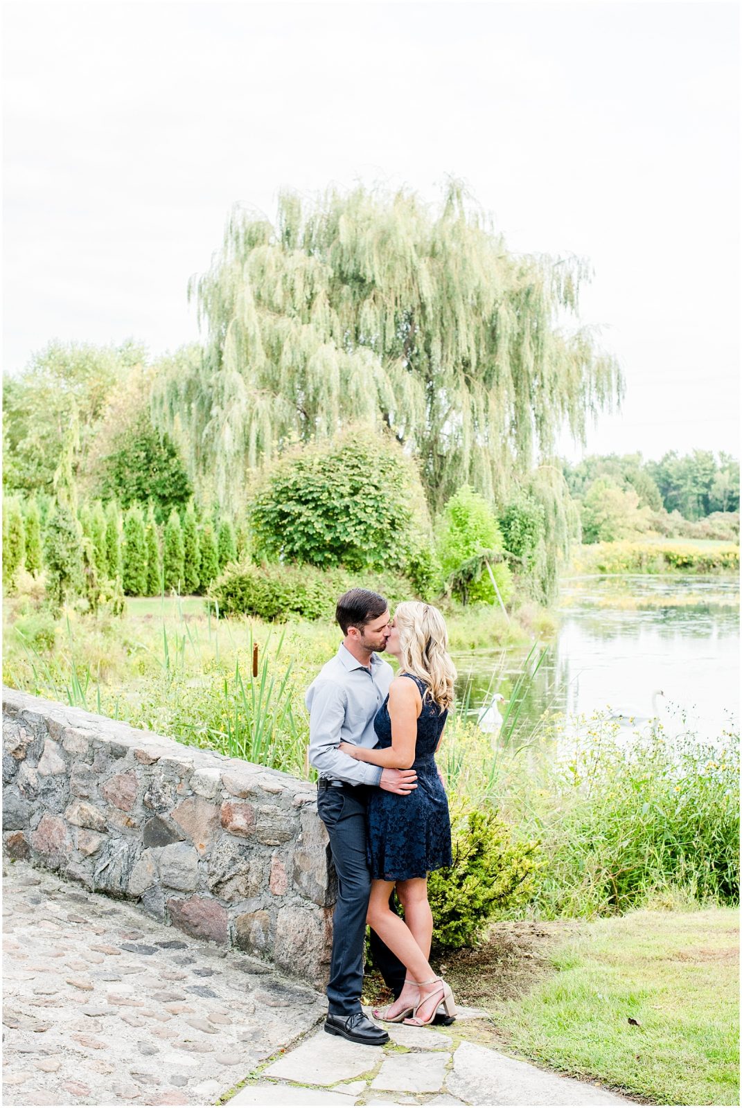 whistling gardens engagement session fiance couple snuggling kissing