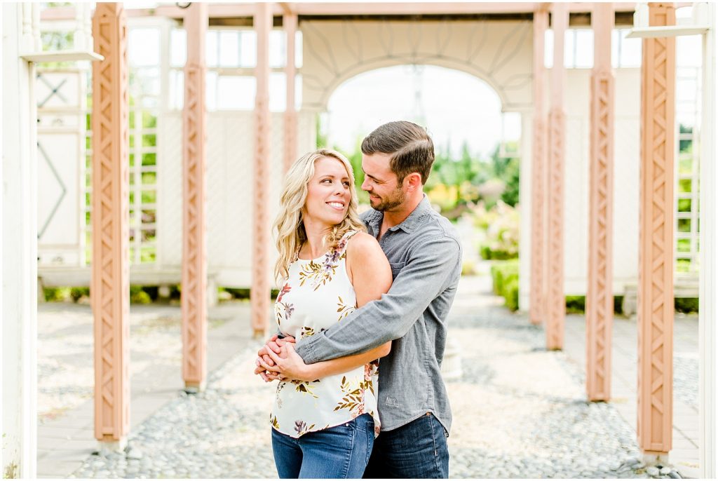 whistling gardens engagement session fiance couple snuggling