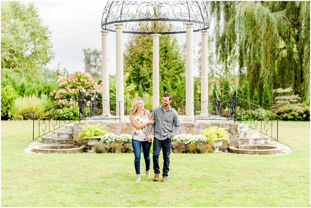 whistling gardens engagement session fiance couple walking