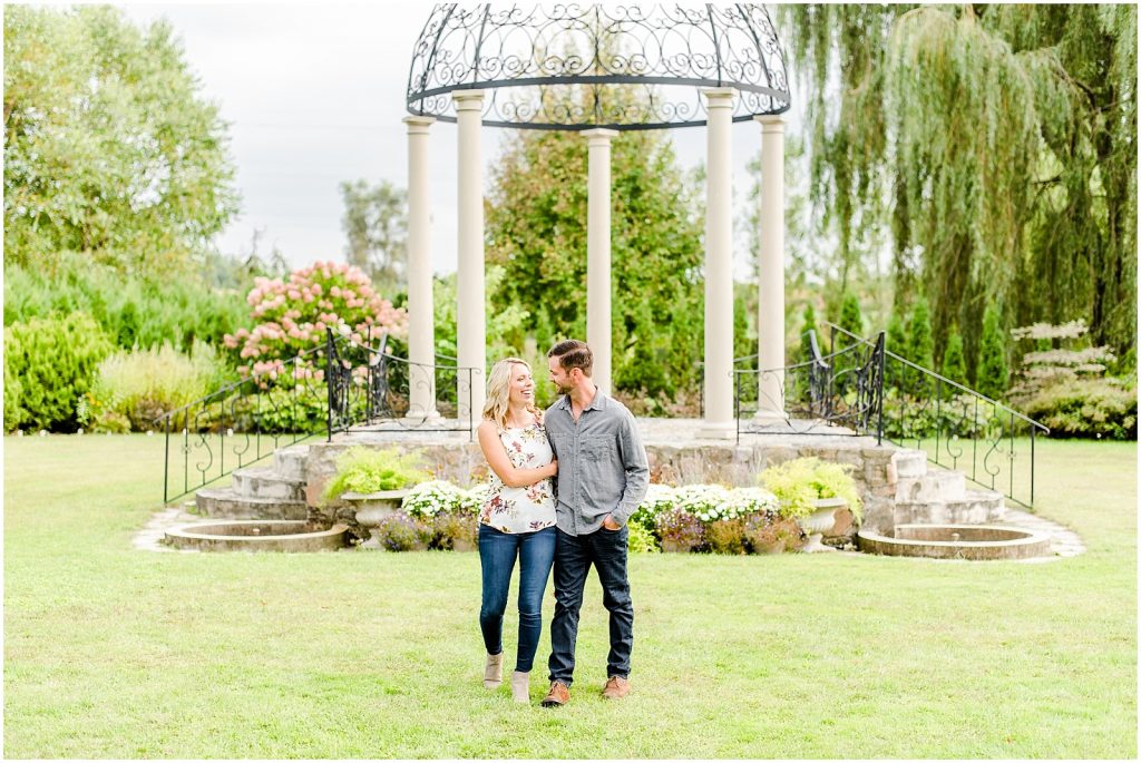 whistling gardens engagement session fiance couple walking