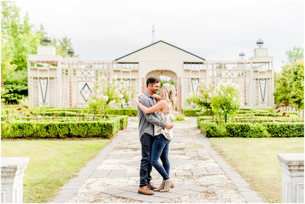 whistling gardens engagement session fiance couple kissing