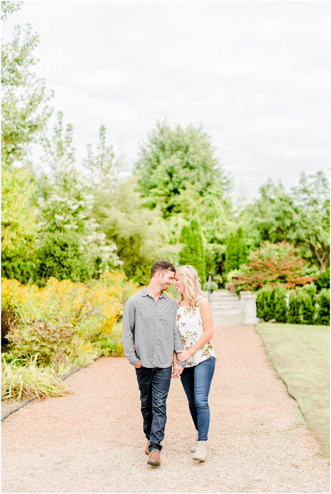 whistling gardens engagement session fiance couple walking