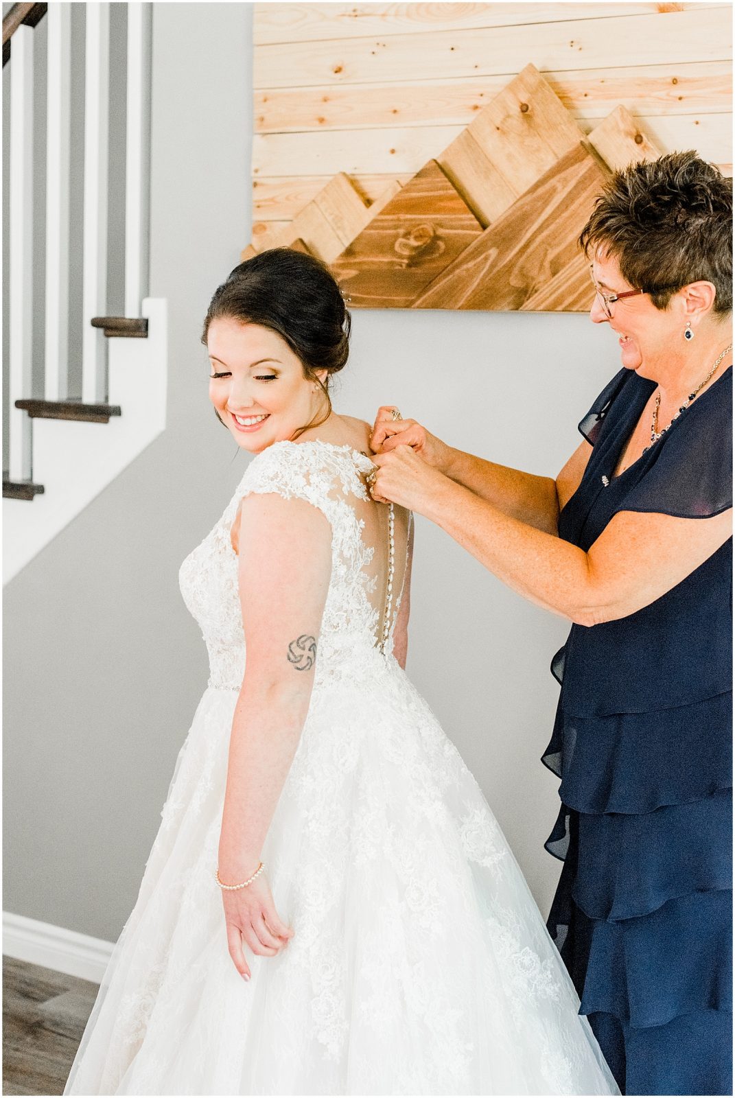 St. Mary's Countryside Wedding mother helping bride in her dress