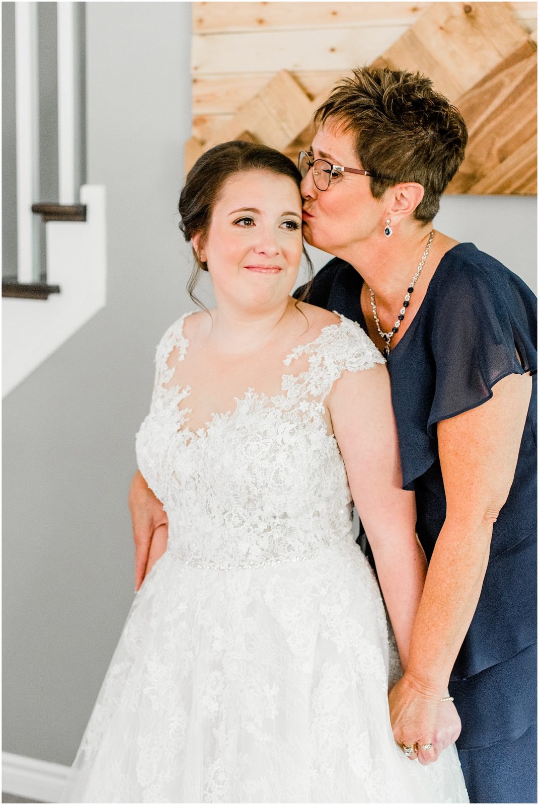 St. Mary's Countryside Wedding mother of the bride kissing her daughter