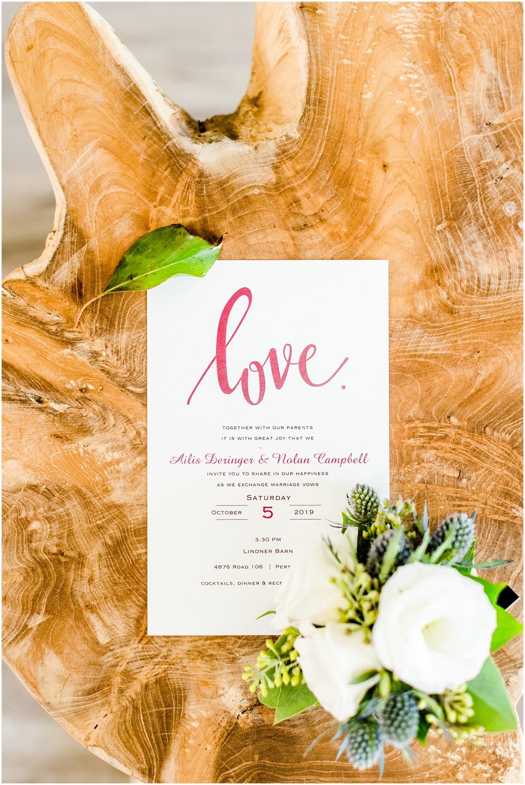 St. Mary's Countryside Wedding invitation on tree trunk stool