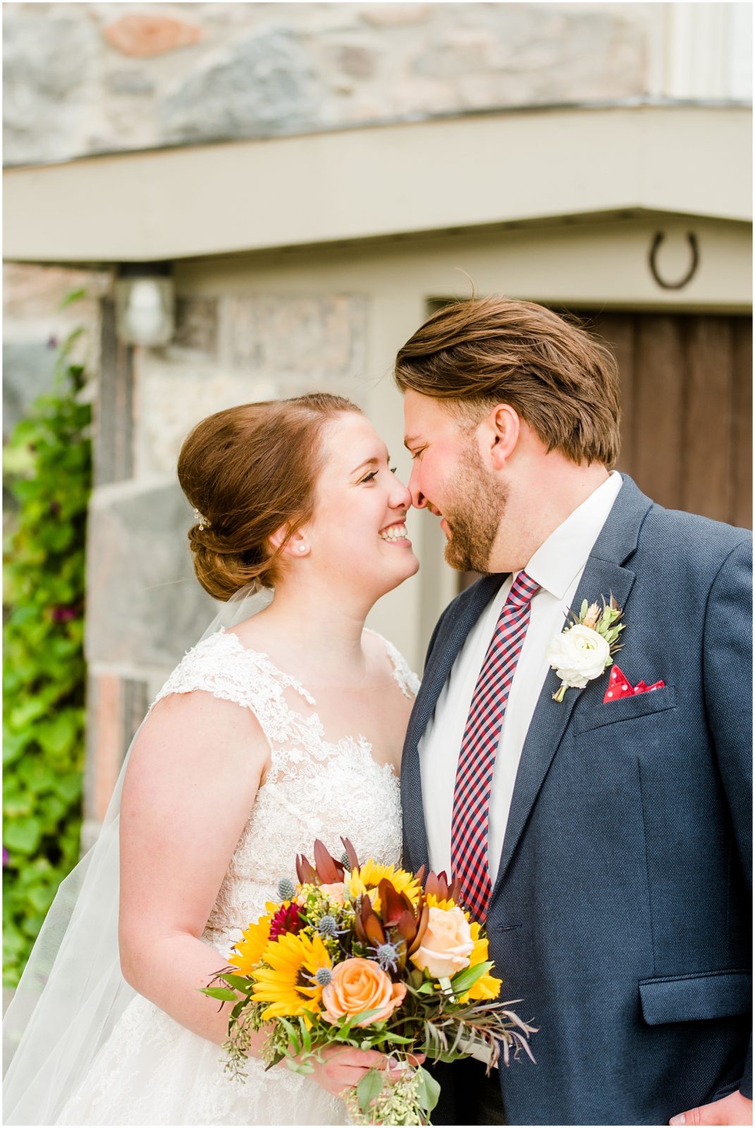 St. Mary's Countryside Wedding bride and groom in front of stone house