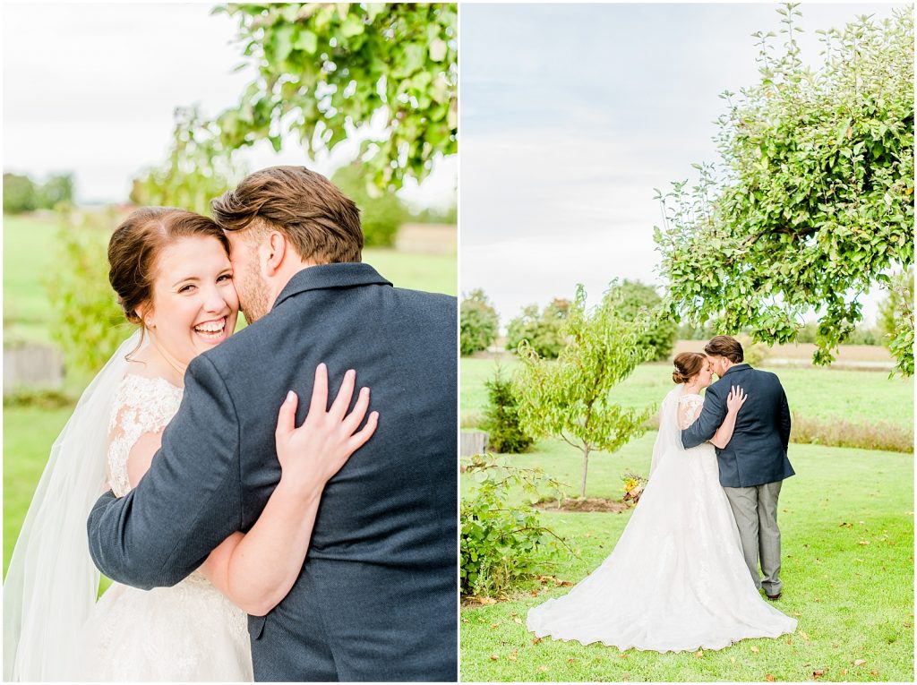 St. Mary's Countryside Wedding bride and groom hugging in front of apple tree