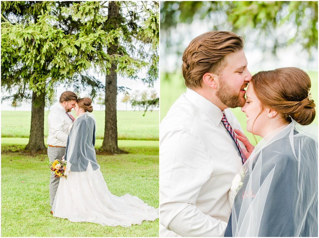 St. Mary's Countryside Wedding bride with husband's jacket and groom