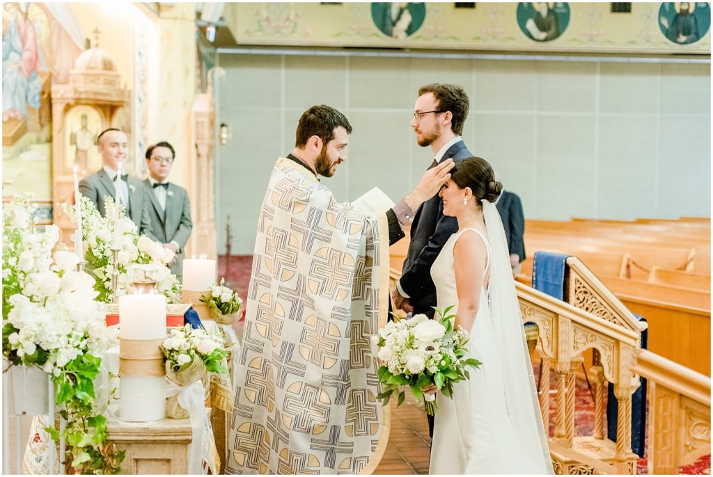 Burnaby Vancouver Wedding couple receiving blessing from the priest