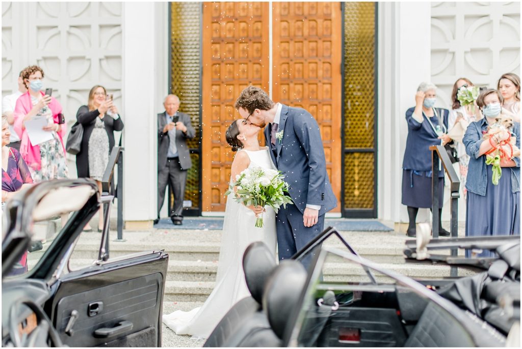 Burnaby Vancouver Wedding couple kisses in front of church