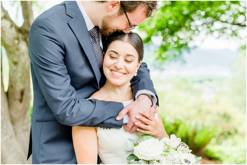 Burnaby Vancouver Wedding Bride is hugging groom