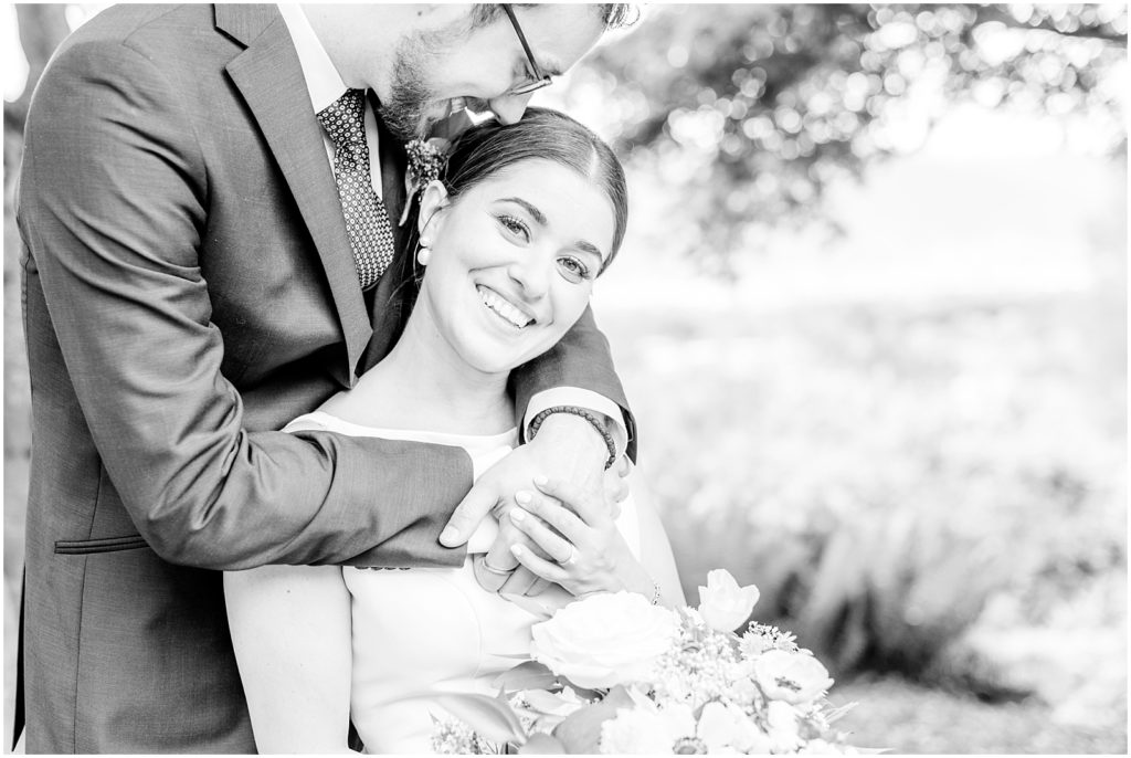 Burnaby Vancouver Wedding Black and White photo of Groom Kissing Bride