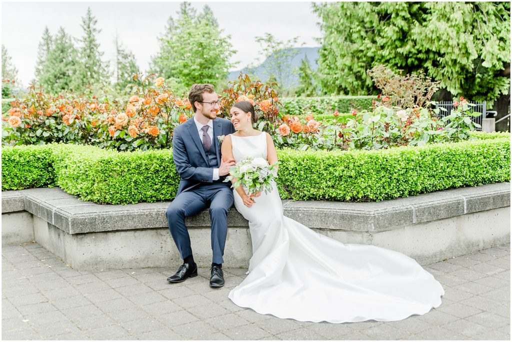 Burnaby Vancouver Wedding Bride and Groom sitting at the UBC Rose Garden