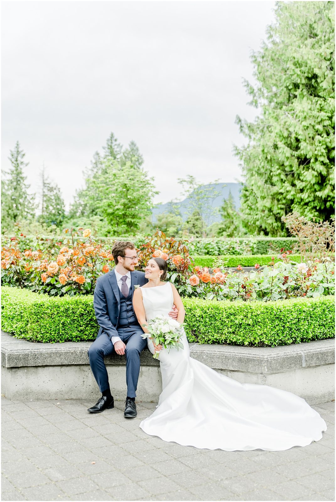 Burnaby Vancouver Wedding Bride and Groom sitting in the UBC Rose Garden