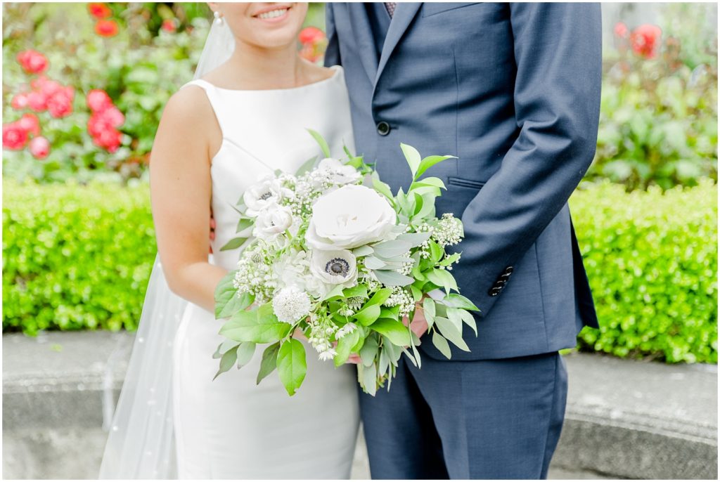 Burnaby Vancouver Wedding Up Close photo of the Bridal Bouquet in front of the couple at the UBC Rose Garden