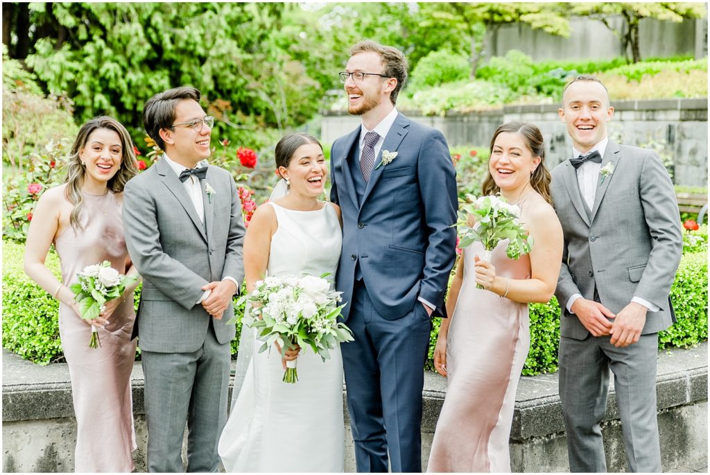 Burnaby Vancouver Wedding Bridal Party laughing together in the UBC Rose Garden