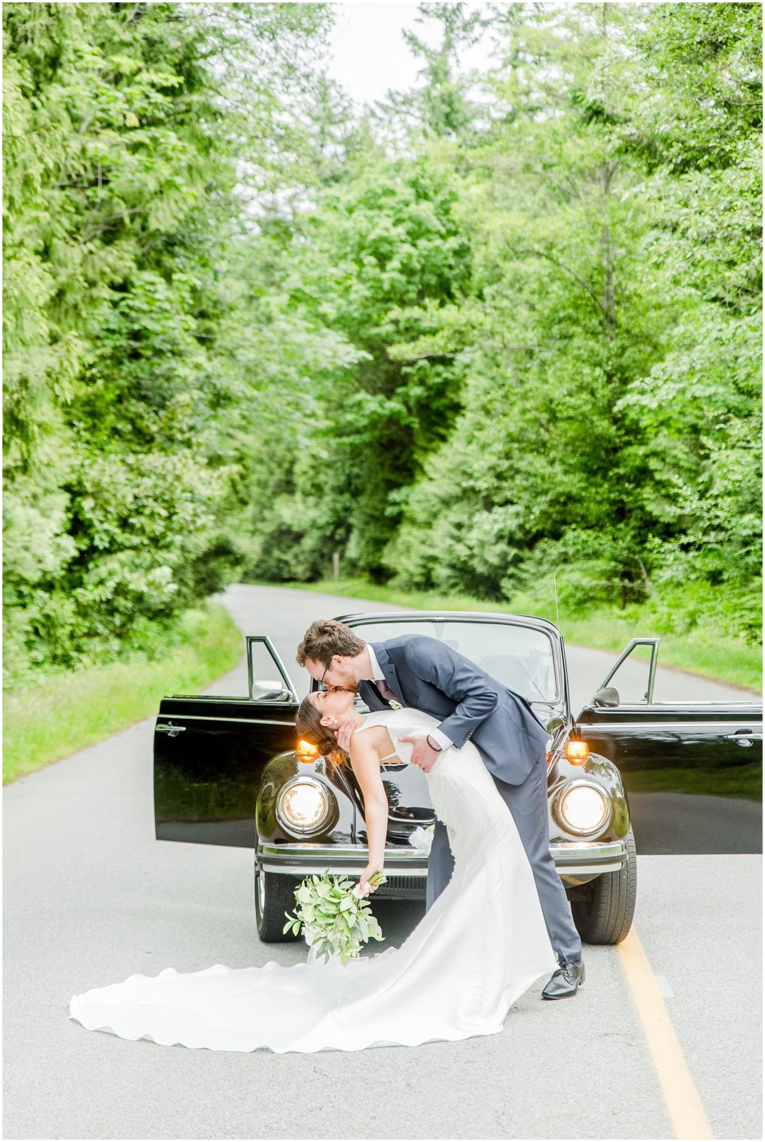 Burnaby Vancouver Wedding Groom dipping and kissing Bride in front of VW Beetle on Imperial Drive