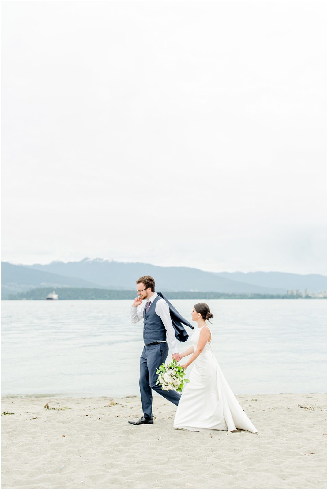 Burnaby Vancouver Wedding Bride and Groom walking at Spanish Banks