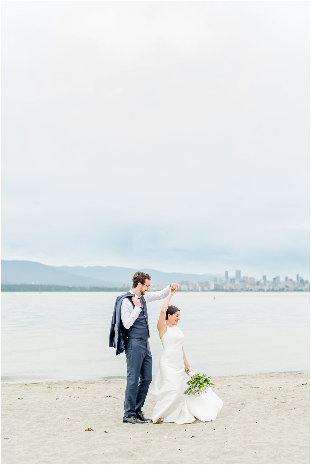 Burnaby Vancouver Wedding Bride and Groom dancing on the beach at Spanish Banks