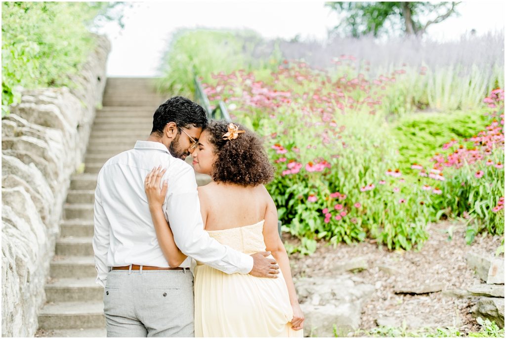 Sam Lawrence Park Hamilton Engagement Session couple hugging in front of steps 