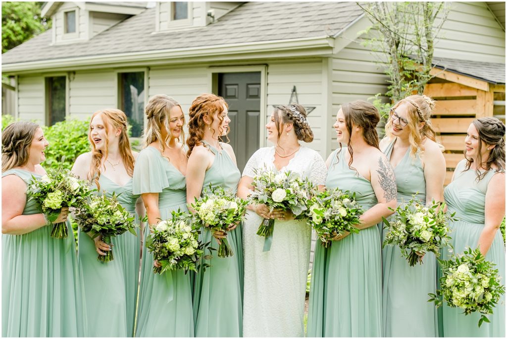 Princeton backyard wedding bride and bridesmaids laughing together