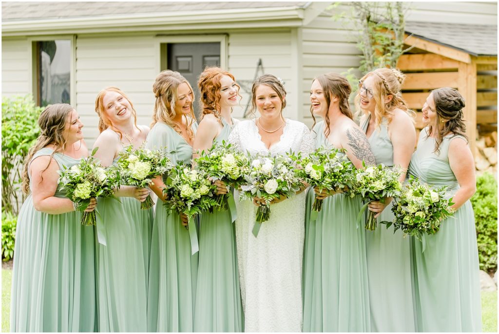 Princeton backyard wedding bride and bridesmaids laughing together