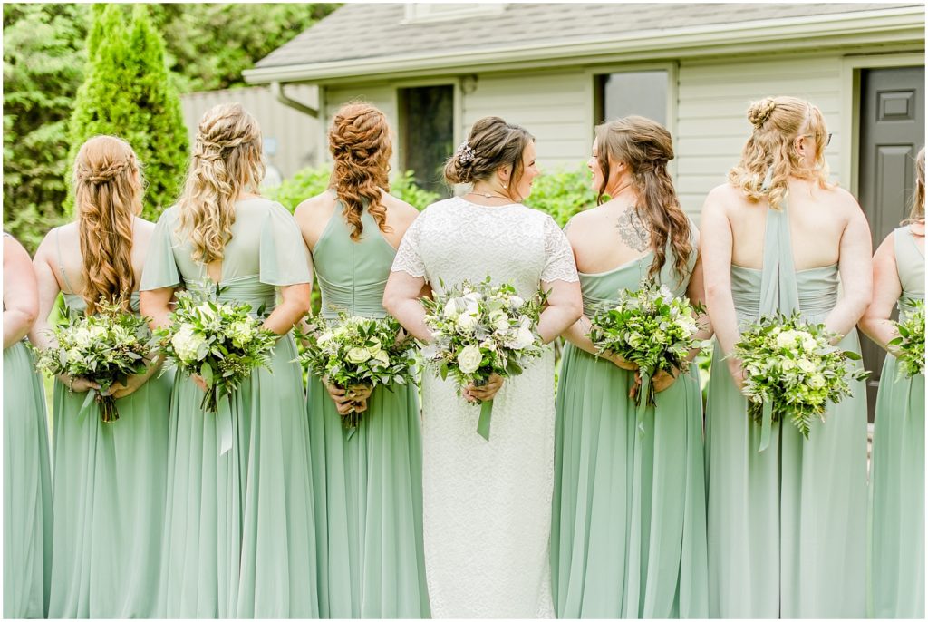 Princeton backyard wedding bridesmaids and bride holding bouquets behind their backs