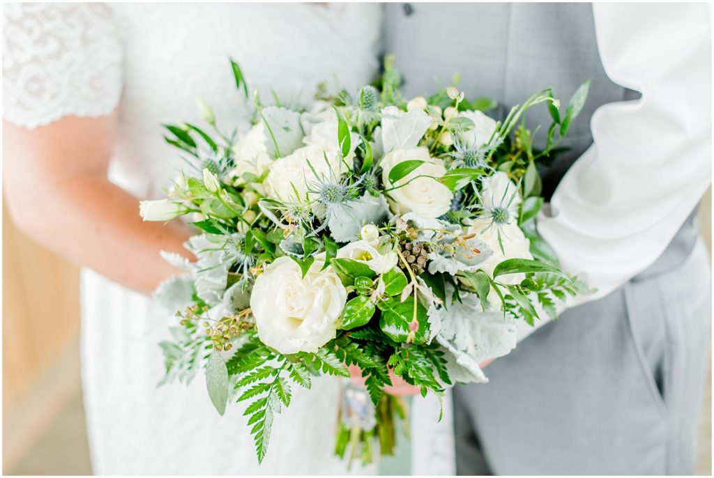 Princeton backyard wedding bouquet in the hands of bride and groom