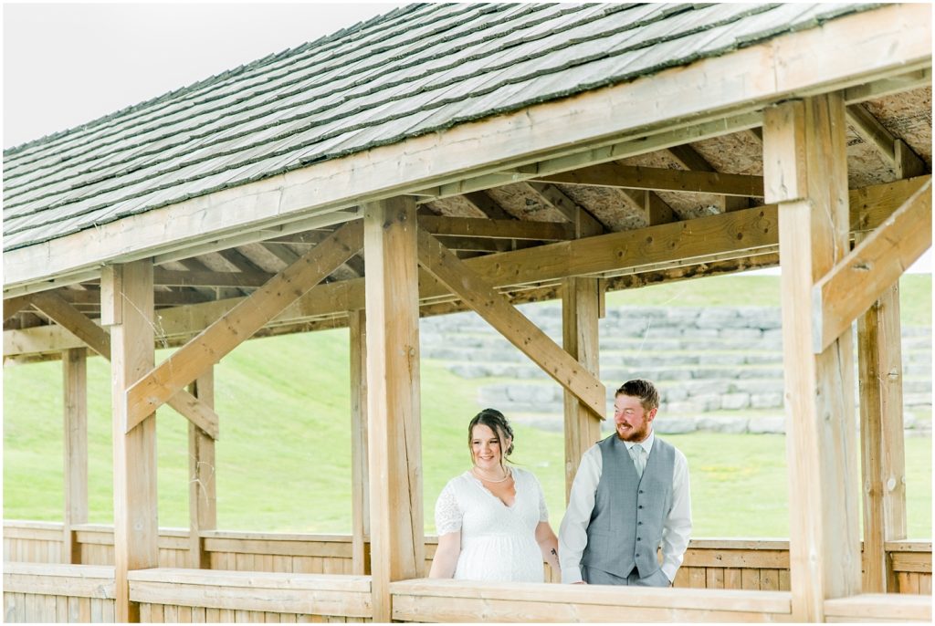 Princeton backyard wedding bride and groom walking on covered country bridge