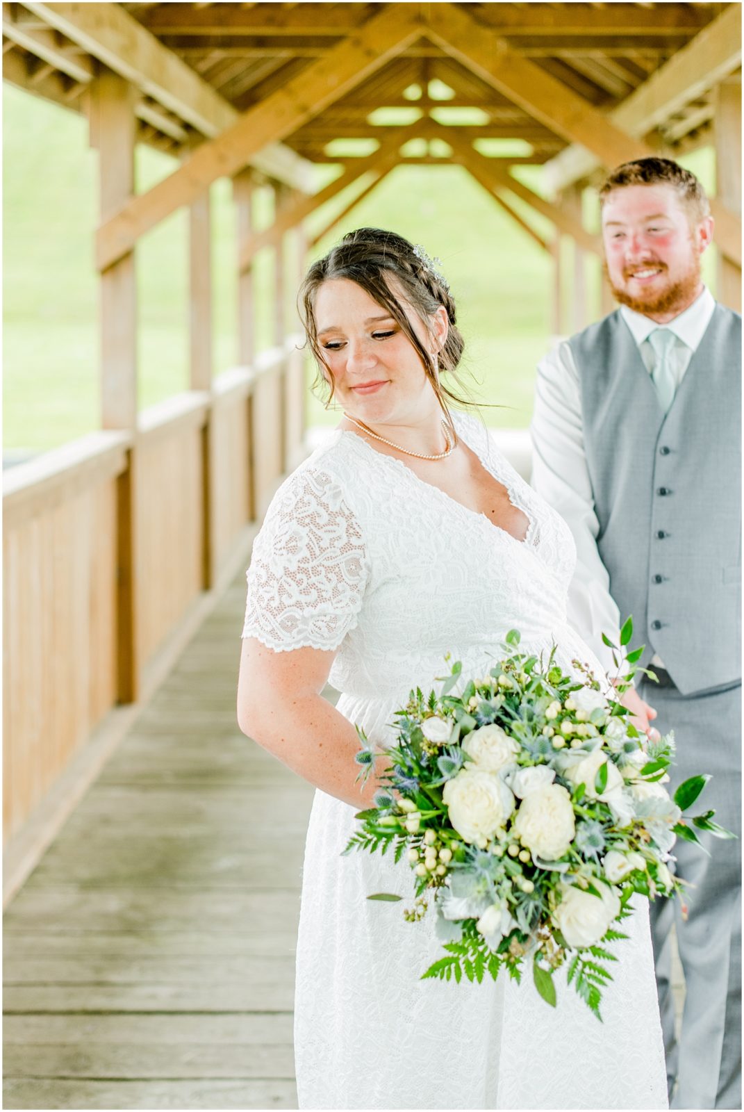 Princeton backyard wedding bride and groom on covered country bridge