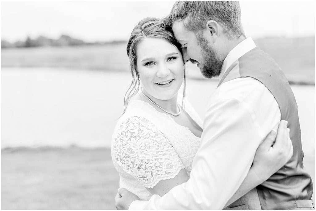 Princeton backyard wedding bridge and groom hugging in field