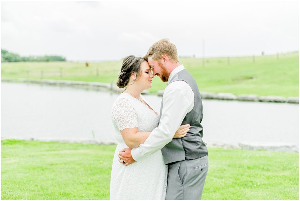 Princeton backyard wedding couple hugging in field