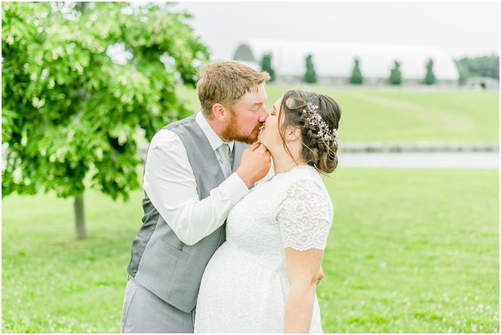 Princeton backyard wedding groom pulling bride in for a kiss