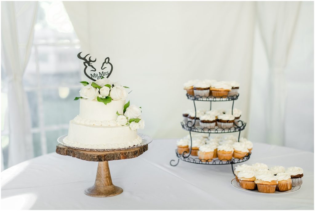 Princeton backyard ivory wedding cake with deer cake topper and roses