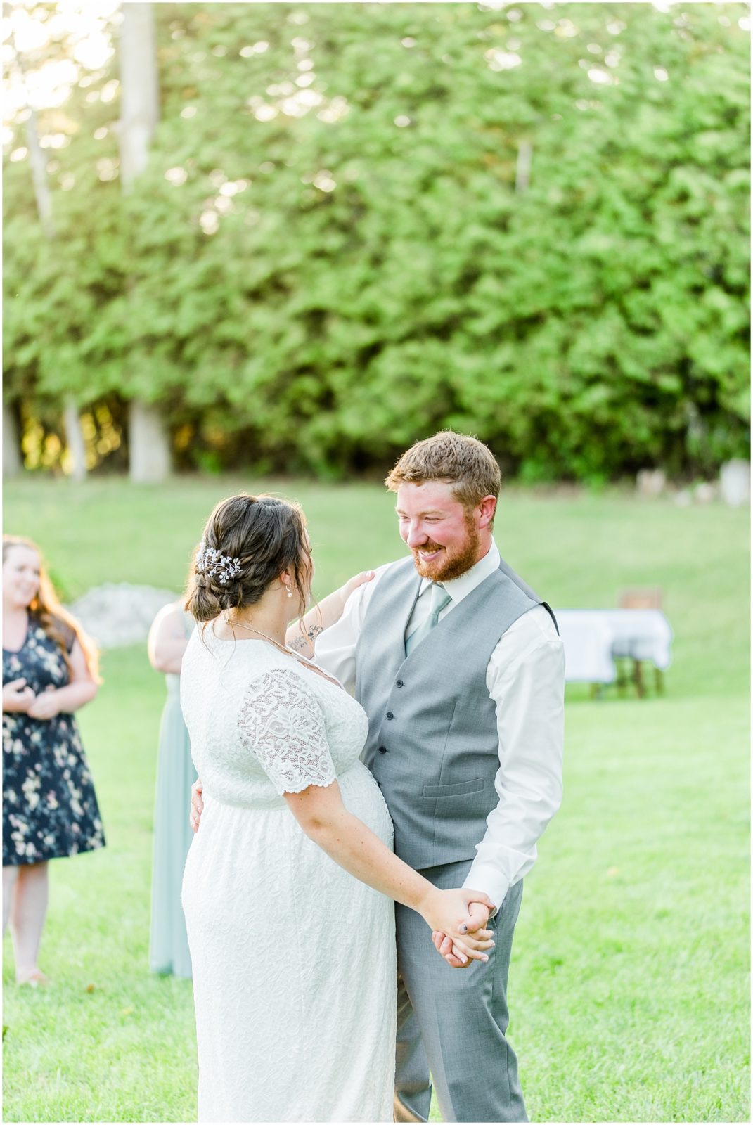 Princeton backyard wedding groom smiling at bride during first dance