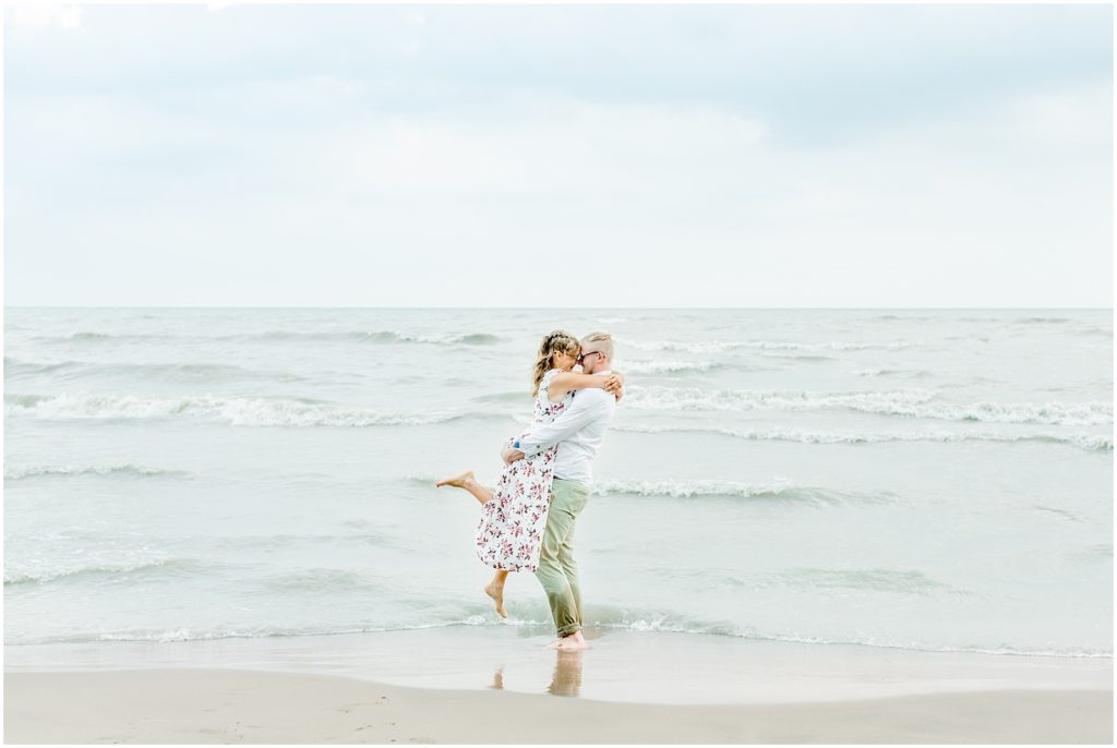 Long Point Engagement Session couple hugging in the water