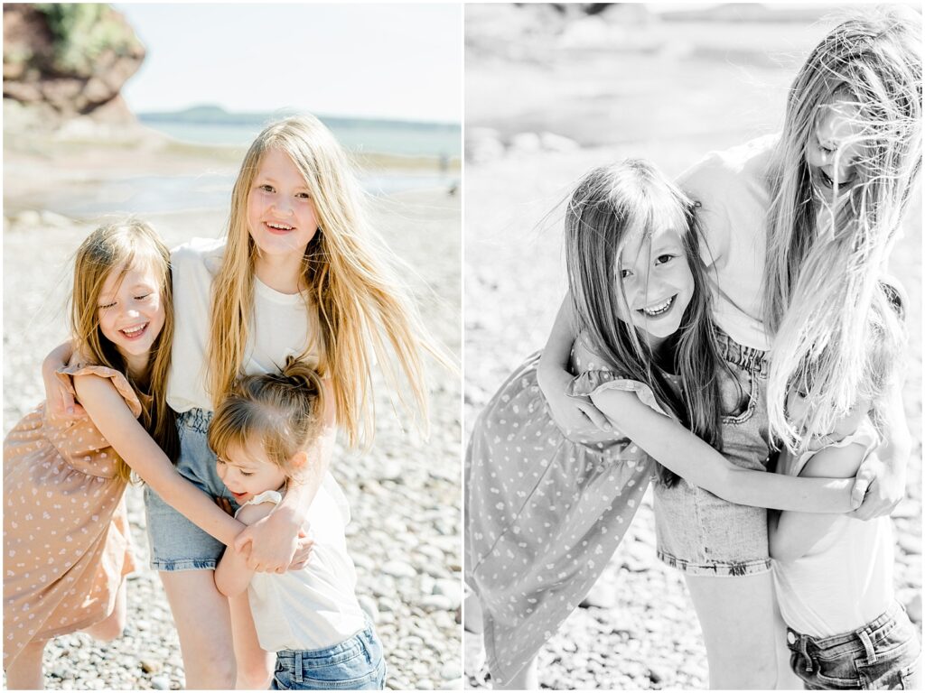 sisters laughing on the shore hugging each other 