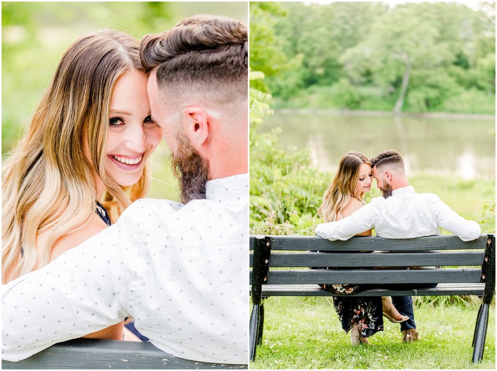 Couple sitting at bench by river at Ruthven park