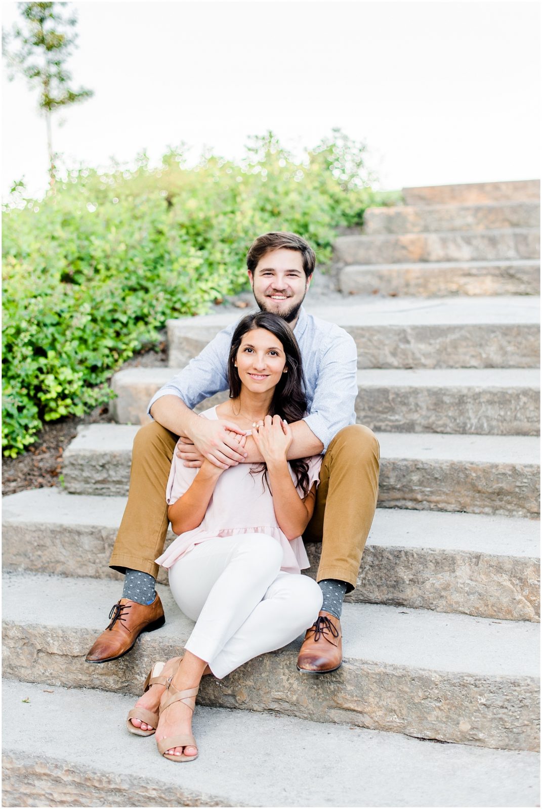 niagara on the lake queens park engagement session couple sitting on steps