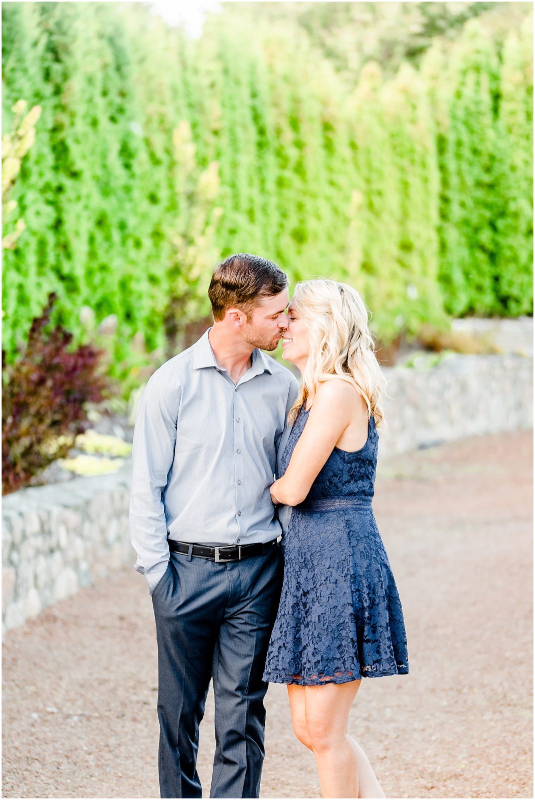 whistling gardens engagement session fiance couple snuggling kissing