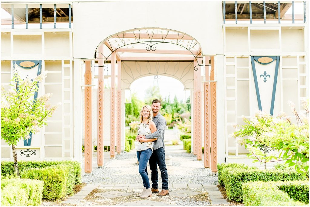 whistling gardens engagement session fiance couple snuggling