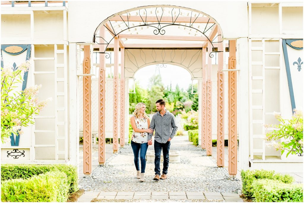 whistling gardens engagement session fiance couple walking